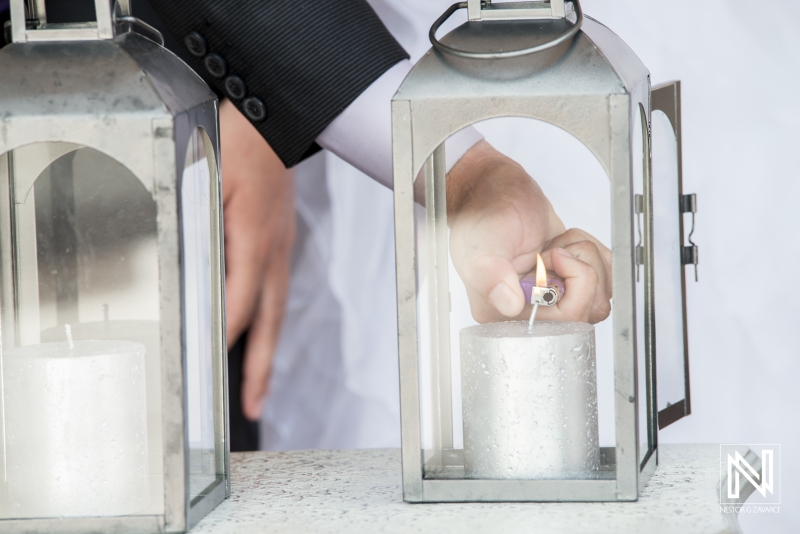 Hand lighting a candle