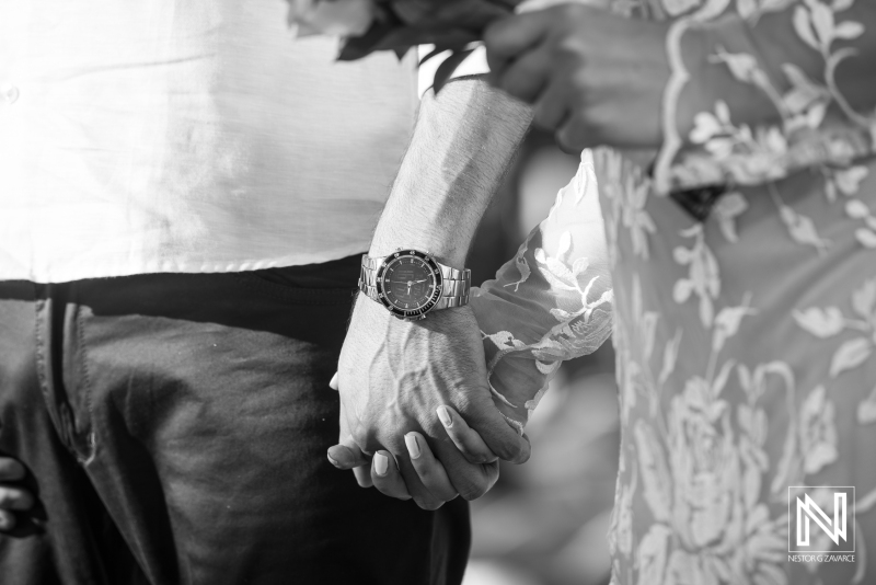 Bride and groom holding hands together