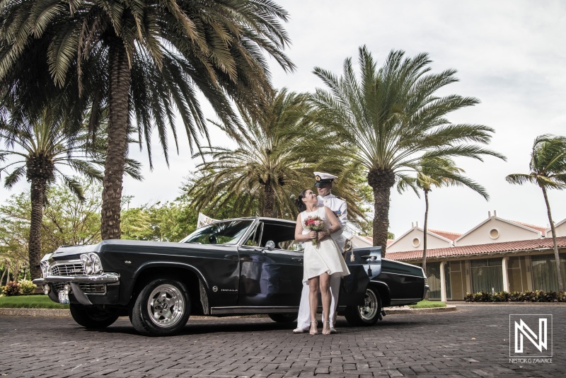 Bride and Groom with old black cadillac
