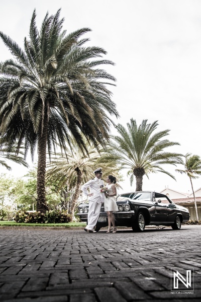 Bride and Groom with old black cadillac