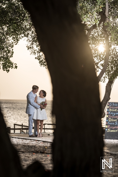 Bride and Groom photoshoot with  trees, beach  and sunset