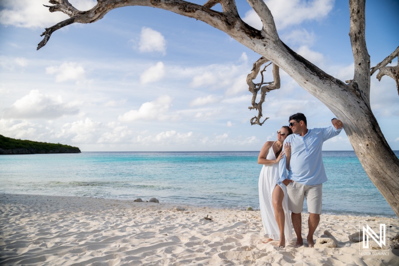 Couple enjoys trash the dress photoshoot at Cas Abao Beach in Curacao during sunny afternoon