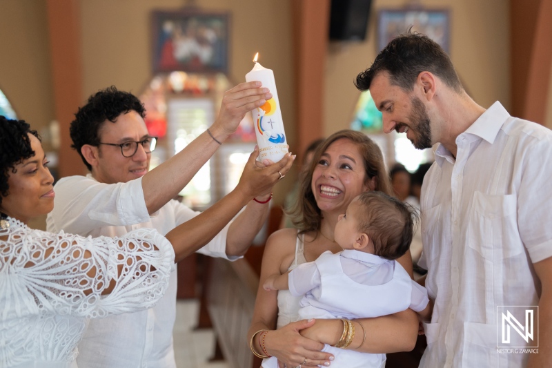 Family gathers for a joyful baptism ceremony in Curacao celebrating the blessing and initiation of a child into the faith community