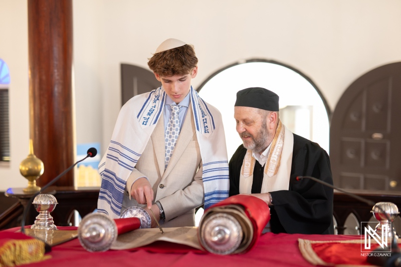 Bar Mitzvah ceremony at Mikve Israel-Emanuel Synagogue in Curacao with young boy and rabbi