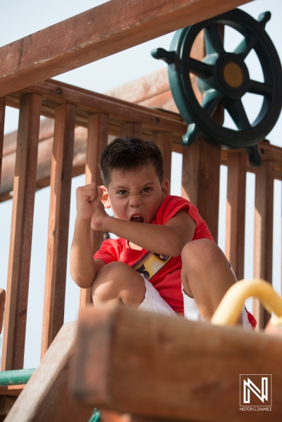 Celebrating a child's birthday in Curacao with fun activities and playful moments on a playground