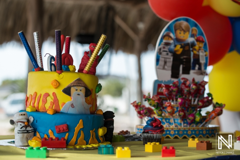 Colorful birthday cake celebration setup in Curacao with themed decorations and a vibrant atmosphere