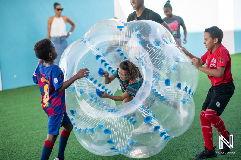 Kids enjoying a fun-filled birthday celebration in Curacao with bubble soccer activities and laughter