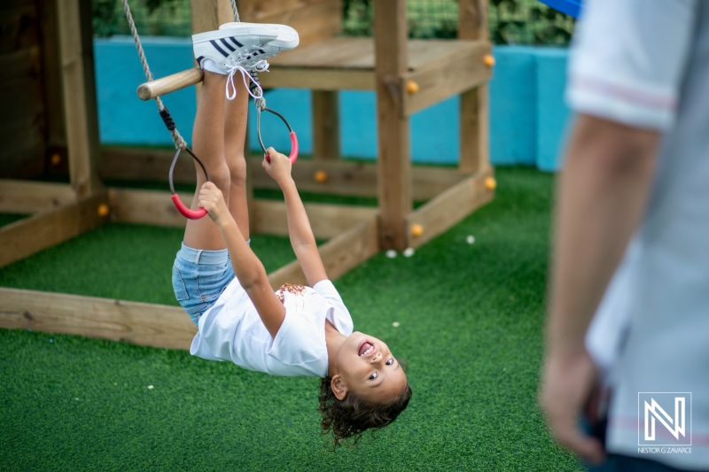 Celebration of a child's birthday in Curacao with outdoor swings and joyful activities