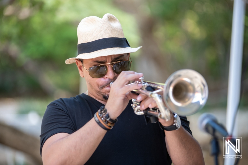 Celebrating a birthday in Curacao with live trumpet music and festive atmosphere in a vibrant outdoor setting