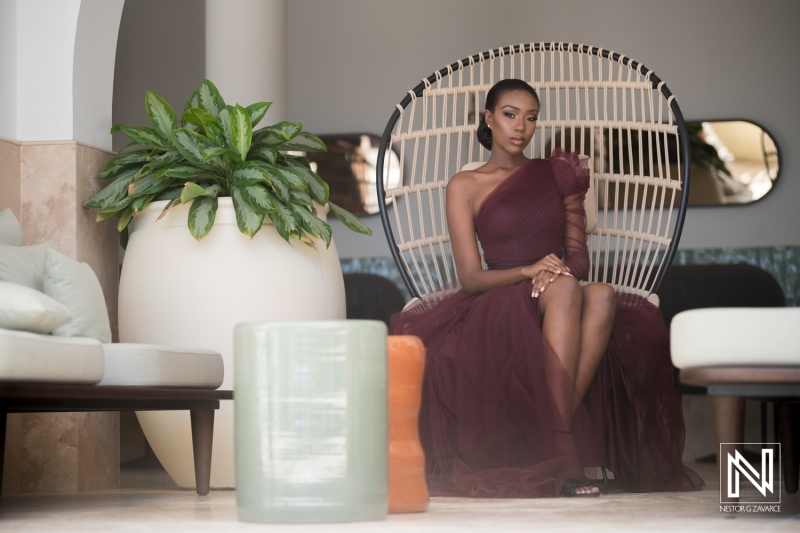 Elegant birthday celebration in Curacao with a stylish individual seated in a beautifully designed chair surrounded by tropical decor