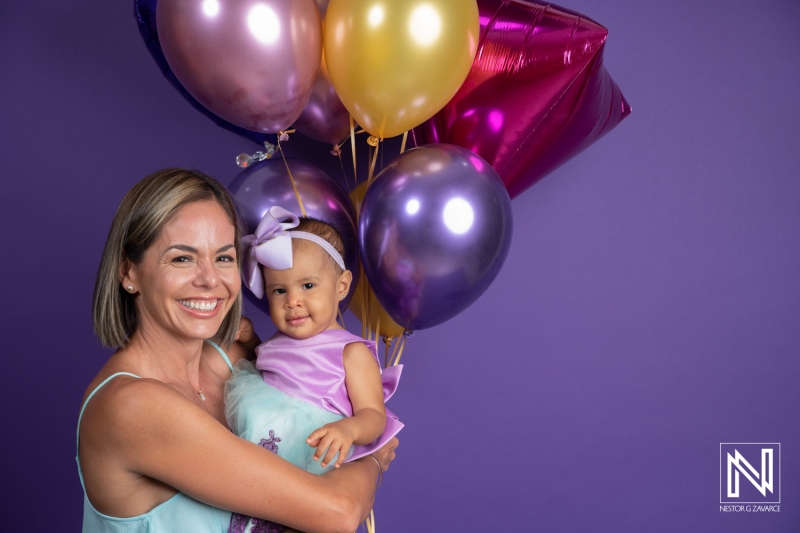 Celebrating a birthday in Curacao with joyful smiles and colorful balloons