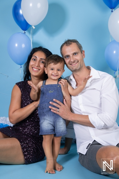 Celebrating a joyful birthday in Curacao with a family, colorful balloons, and smiles