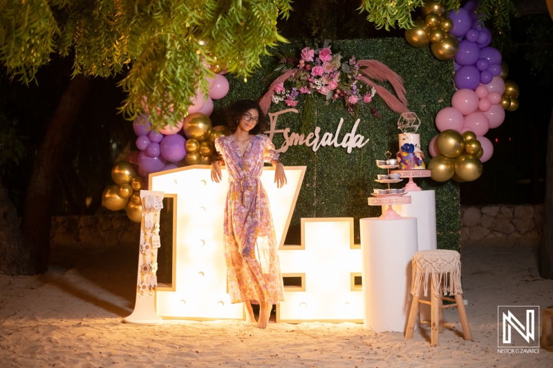 Celebrating a special birthday with vibrant decorations on a beautiful beach in Curacao during the evening