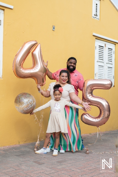 Celebration of a special birthday in Curacao with family and vibrant decorations under clear skies