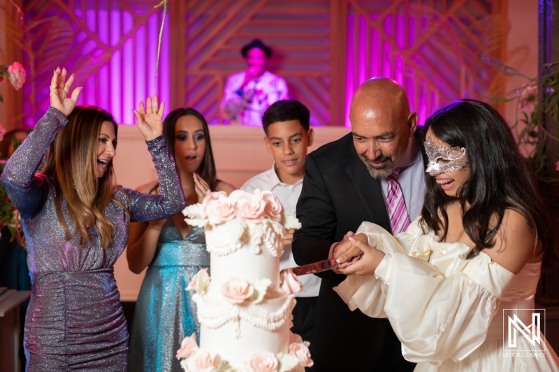 Celebration of a special birthday in Curacao with a cake cutting ceremony surrounded by family and friends