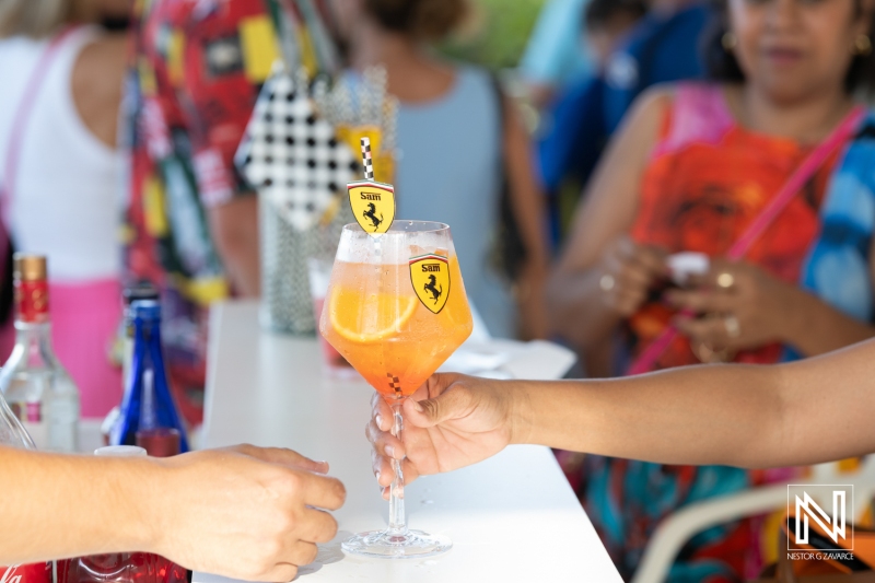 Celebration in Curacao featuring vibrant cocktails for a birthday gathering near the beach at sunset