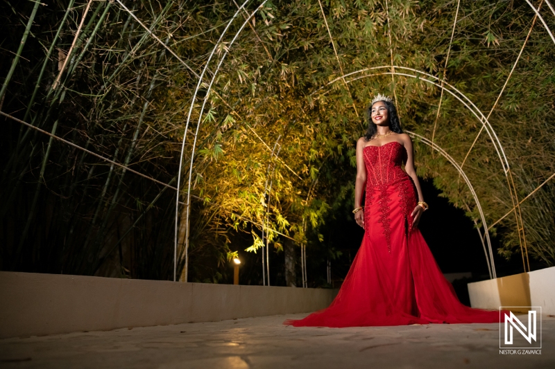 Celebrating a birthday in Curacao with elegance in a stunning red gown at night