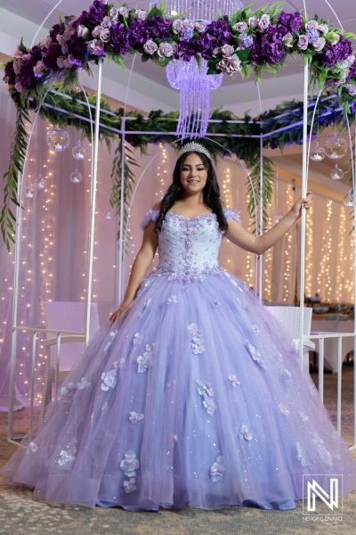 Celebration of Curacao birthday with a young girl in a beautiful purple dress surrounded by enchanting decorations