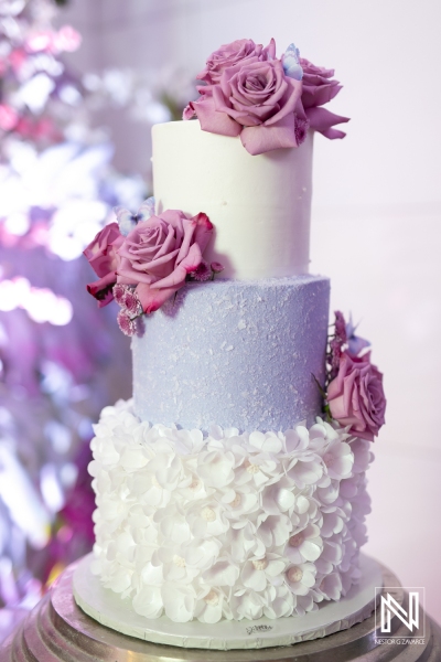 Celebrating a birthday in Curacao with a beautiful multi-tiered cake adorned with fresh flowers