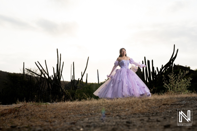 Celebrating a birthday in Curacao with a beautiful purple dress against a stunning natural backdrop