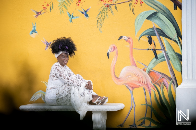 Birthday celebration at Avila Beach Hotel in Curacao with colorful mural background and joyful moments captured