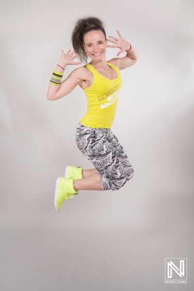 Jumping dancer showcasing vibrant energy in a commercial shoot in Curacao