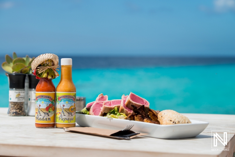 Culinary delights showcased beautifully against the backdrop of the turquoise waters in Curacao during a sunny day