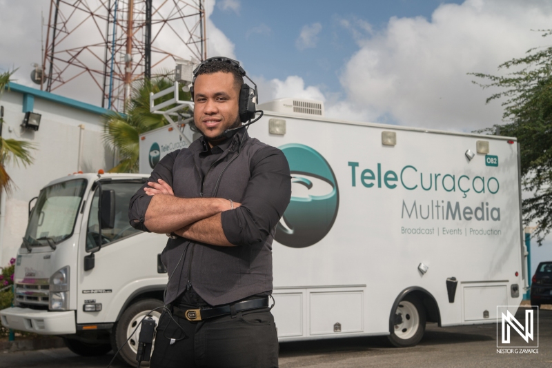 Telecommunication professional engages in live broadcast activities in Curacao for multimedia production and events during daytime