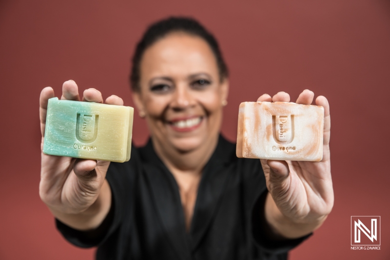 Promoting local craftsmanship with handmade soap from Curacao by a smiling artisan