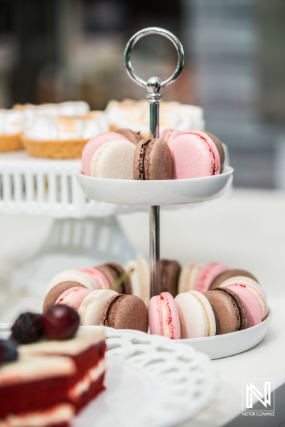 Assorted macarons displayed on a tiered stand at a commercial event in Curacao showcasing sweet delicacies and vibrant colors