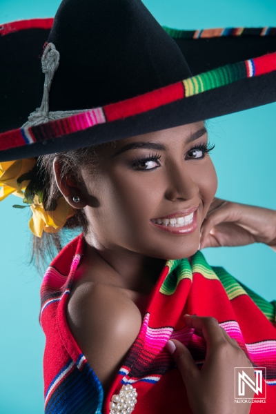 Smiling woman in traditional attire showcases cultural heritage in Curacao during a vibrant commercial shoot