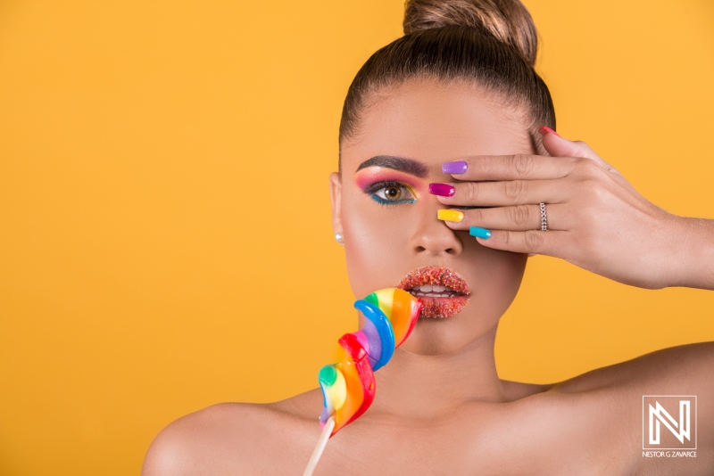 Vibrant fashion shoot showcasing colorful makeup and playful candy in Curacao