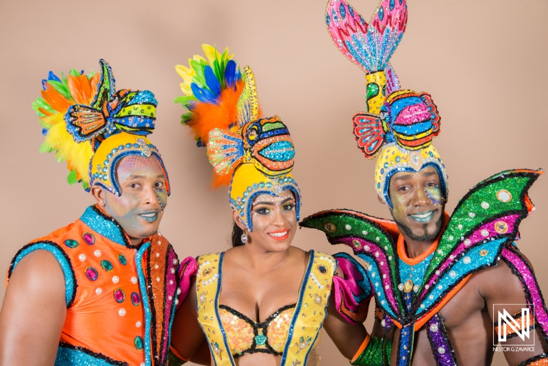 Colorful carnival performers showcase vibrant costumes inspired by marine life at a festival in Curacao during a lively celebration of culture and art