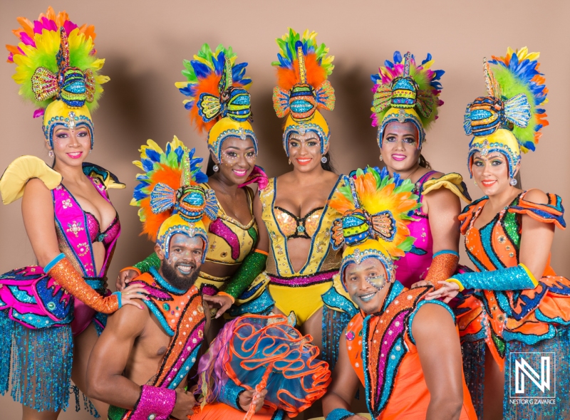 Vibrant performers showcasing traditional costumes in Curacao ready for a lively celebration