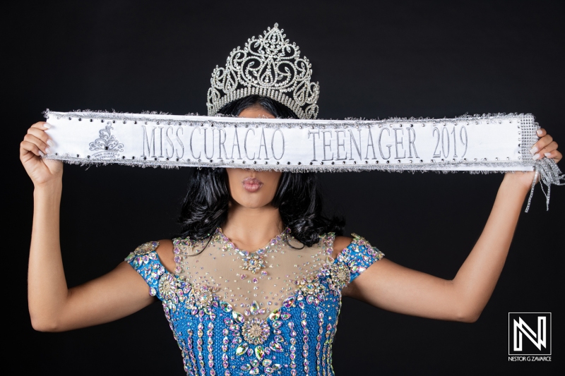 Celebration of beauty and youth in Curacao as a contestant showcases her title in a shimmering outfit