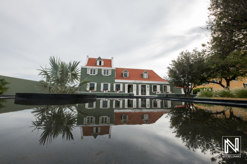 Brand commercial featuring an elegant building reflection in Curacao showcasing local architecture and serene surroundings