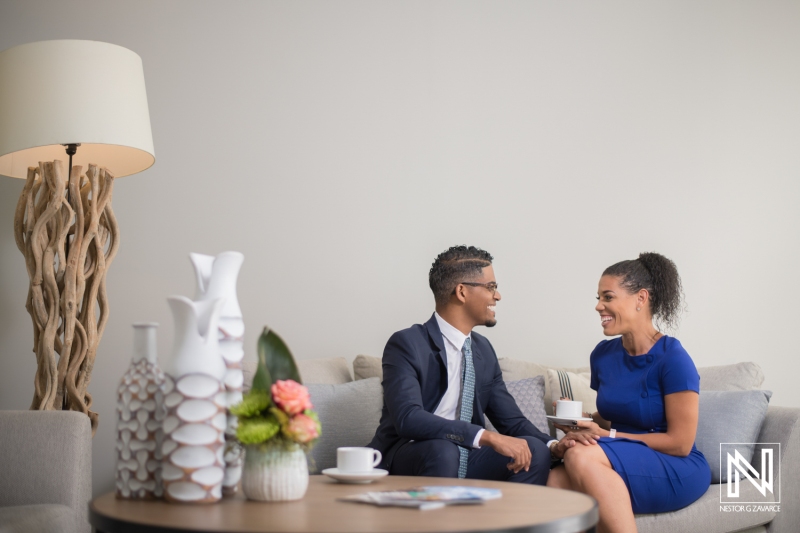 Couple enjoying conversation over coffee in a modern, stylish setting in Curacao