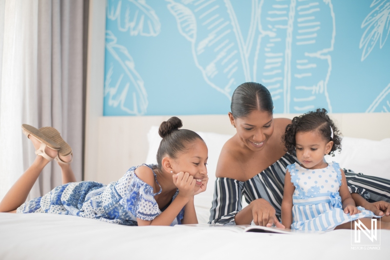 Family enjoying quality time together in a cozy space in Curacao with engaging storytelling and joyful expressions