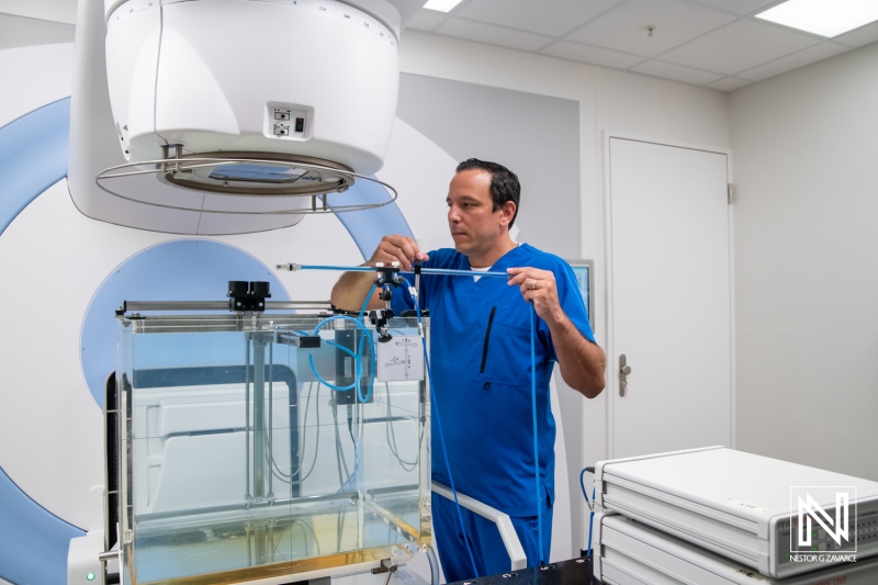 Medical professional prepares equipment for a treatment session in a clinic located in Curacao