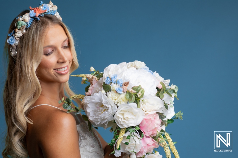 Elegant bride in Curacao adorned with flowers and a beautiful bouquet during a commercial branding campaign