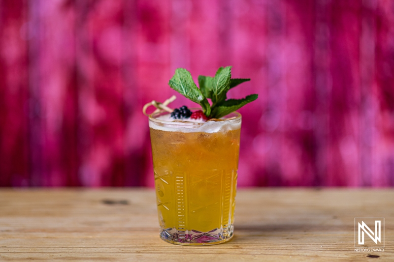 Refreshing tropical cocktail served in Curacao with vibrant backdrop