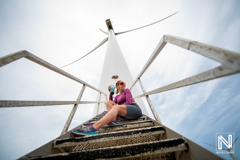 Wind turbine climb in Curacao featuring an active lifestyle and environmental engagement