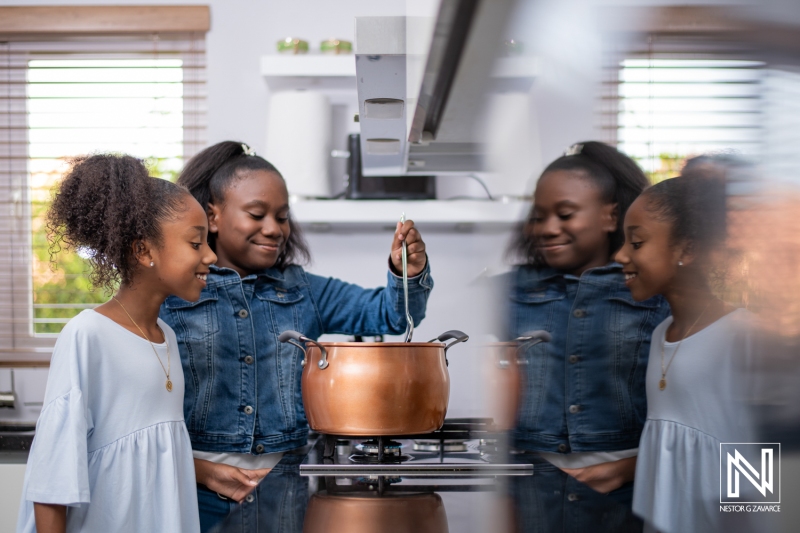 Cooking together in a modern kitchen, two girls enjoy making a delicious meal while bonding in Curacao mid-afternoon