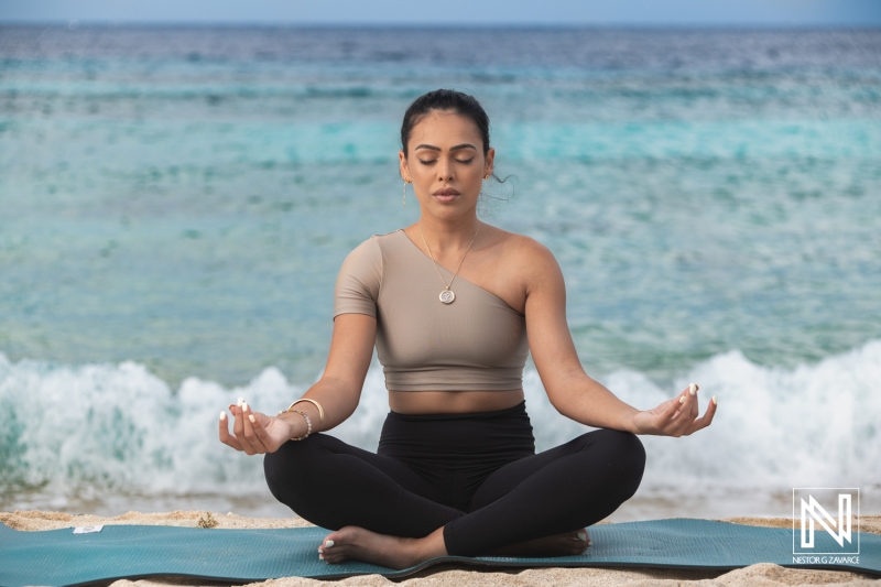 Relaxation and mindfulness practiced on the shores of Curacao during a serene coastal experience