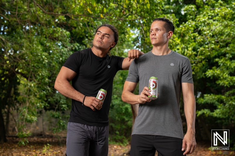 Friends enjoying refreshments in the lush outdoor setting of Curacao while promoting a local brand