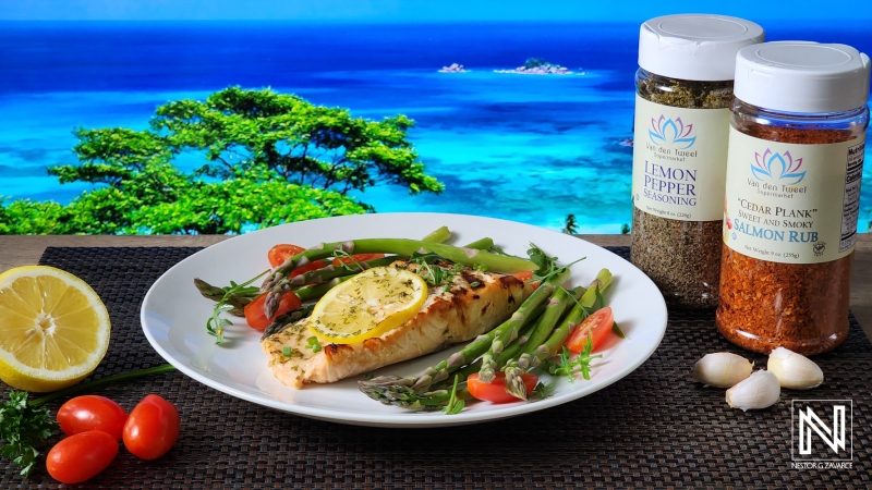 Freshly cooked fish dish served on a plate with a stunning Curacao beach backdrop during a sunny day