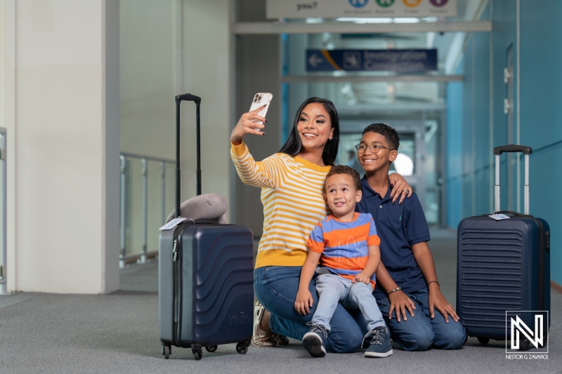 Family enjoys a joyful moment at the airport before their trip to Curacao