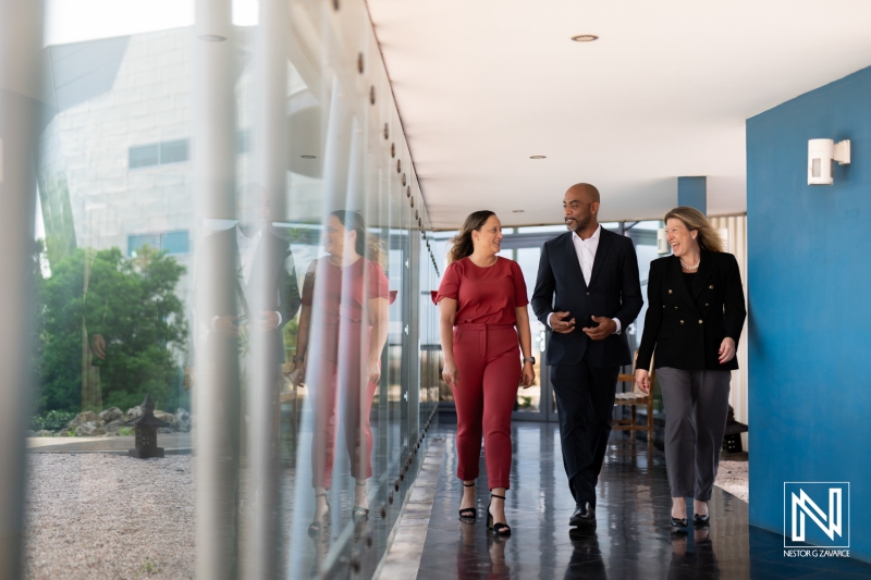 Business professionals networking in Curacao during a commercial event in a modern venue