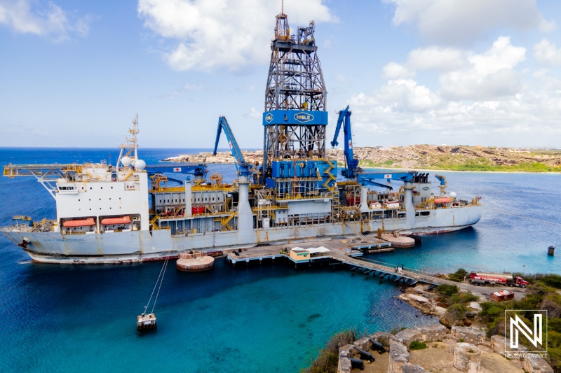 Large drilling platform docked in Curacao showcasing maritime industry and commercial activities