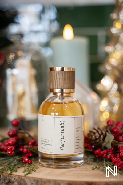 Product photoshoot for ParfumLab Curacao showcasing fragrance bottle with background elements in a festive setting